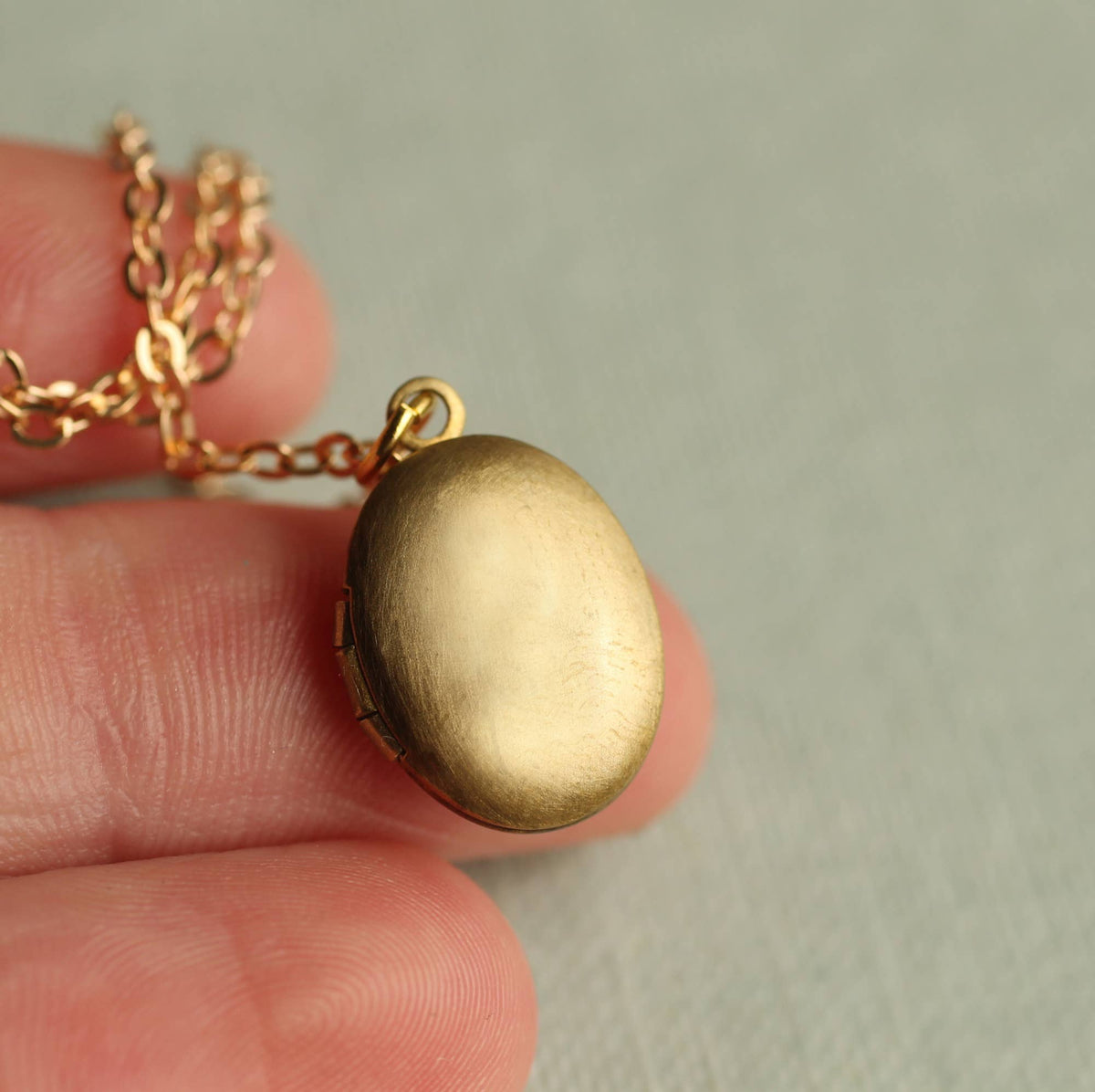 Tiny Oval Engraved Botanical Brass Locket: Thistle Engraving