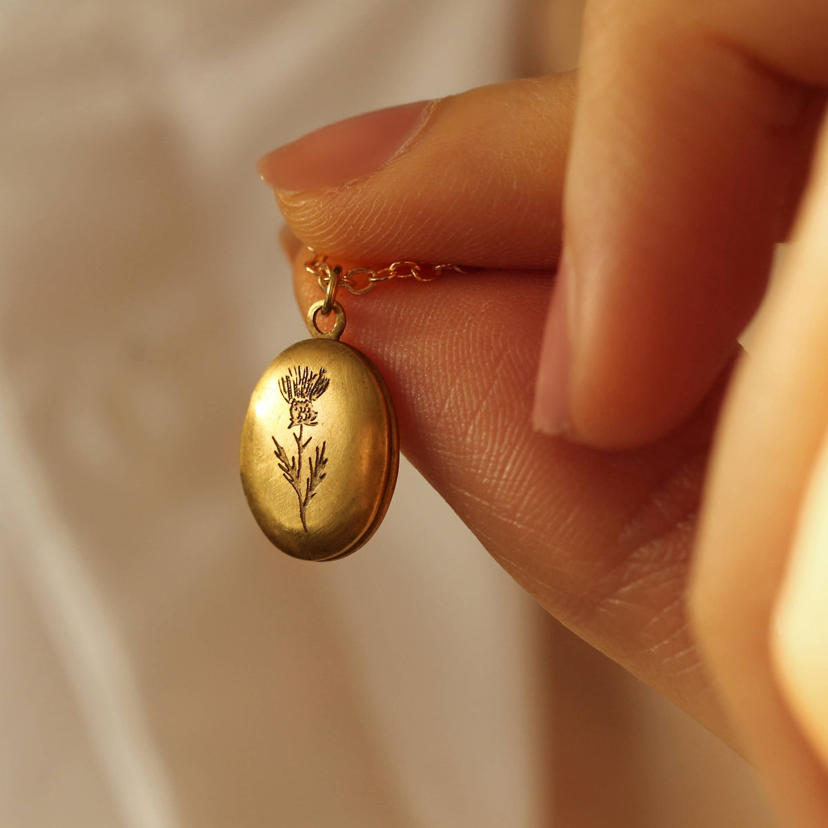 Tiny Oval Engraved Botanical Brass Locket: Thistle Engraving