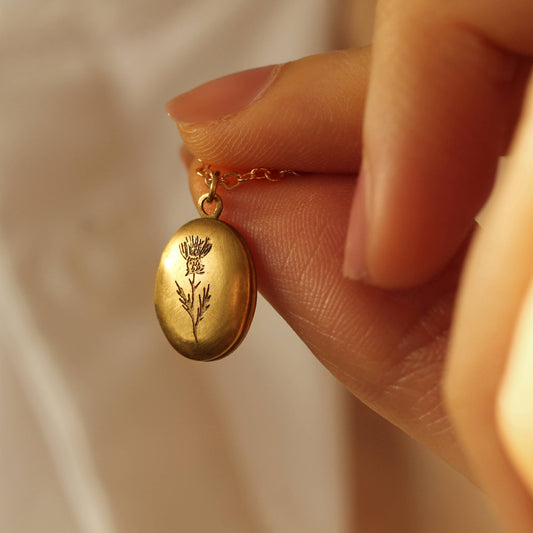 Tiny Oval Engraved Botanical Brass Locket: Thistle Engraving